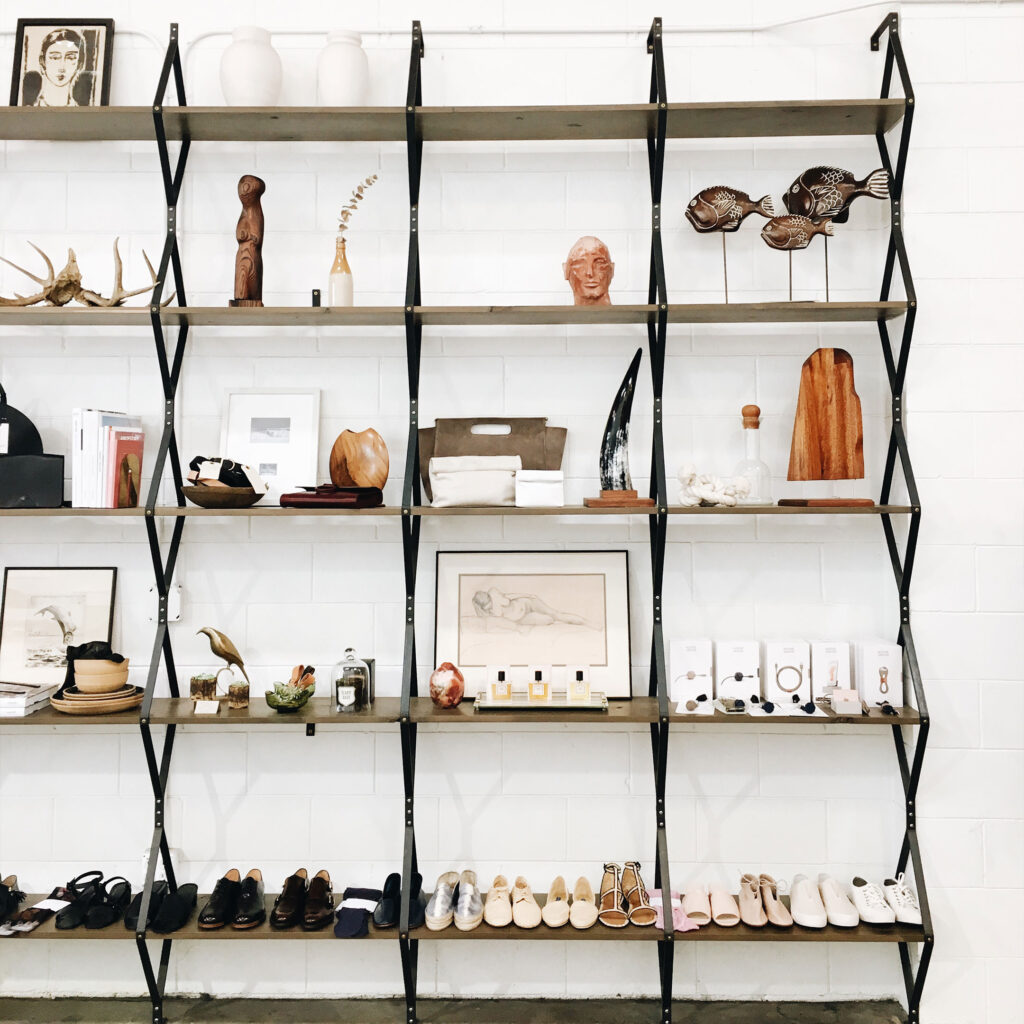 Rhombus Shelf installed in store with shoes and trinkets on it. Photo from Alchemy Works in the Arts District of DTLA