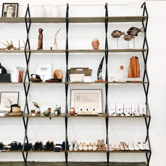 Rhombus Shelf installed in store with shoes and trinkets on it. Photo from Alchemy Works in the Arts District of DTLA