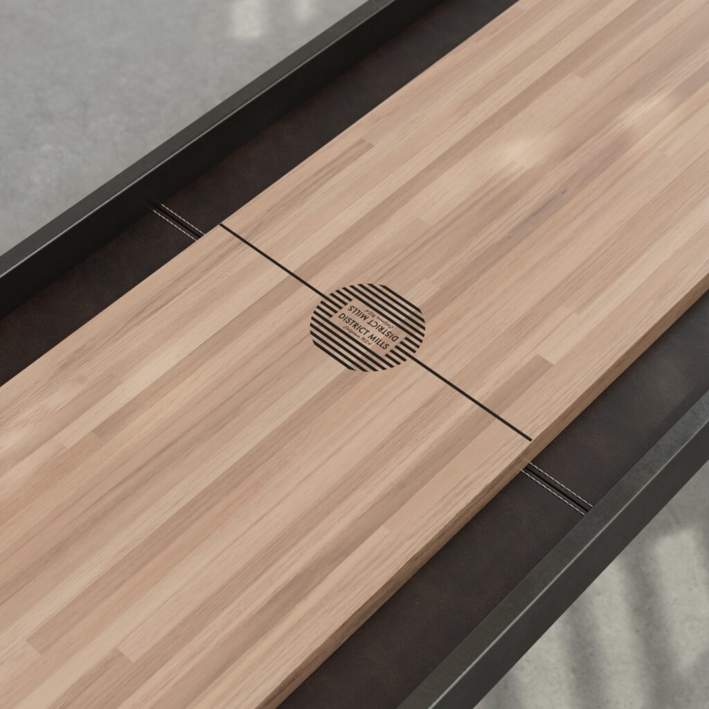 Close-up of Black A-Frame Shuffleboard Table with Oak Playing Surface and Chocolate Leather Gutters
